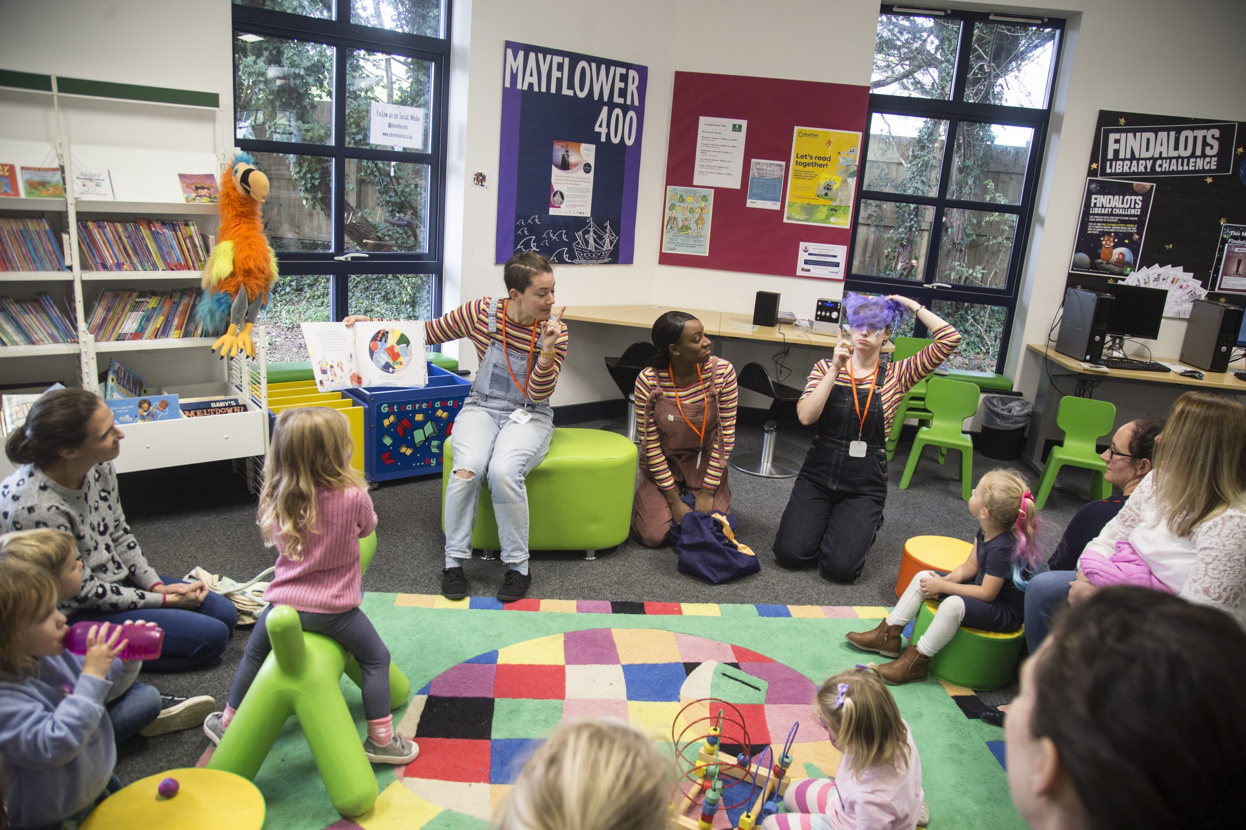 Staff with children in a library